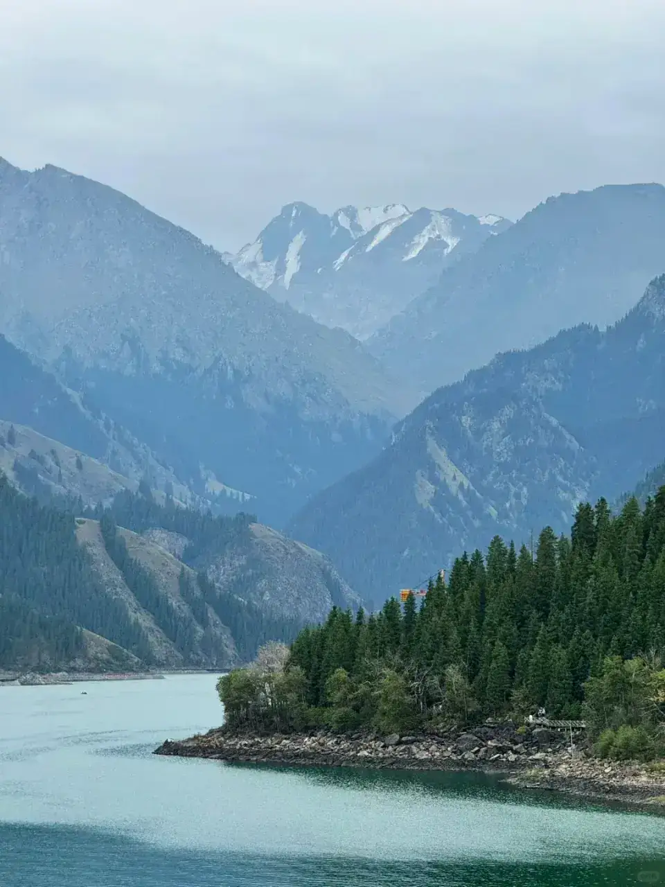 Alpine meadows and snow-capped peaks of the Tianshan range